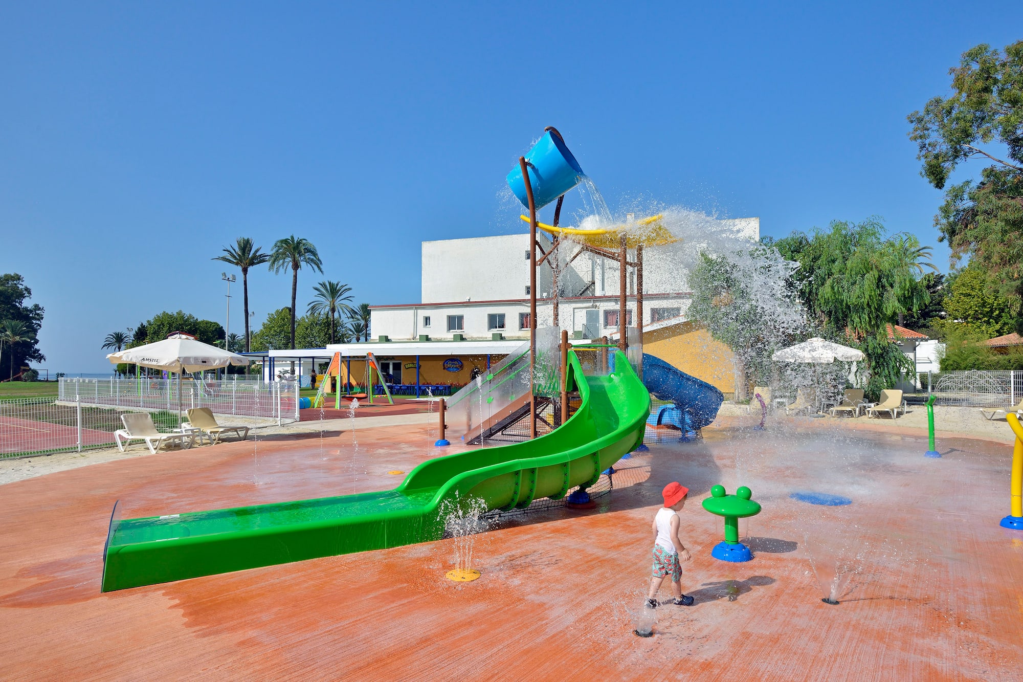 a child playing in a water park