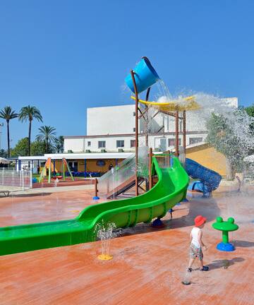 a child playing in a water park