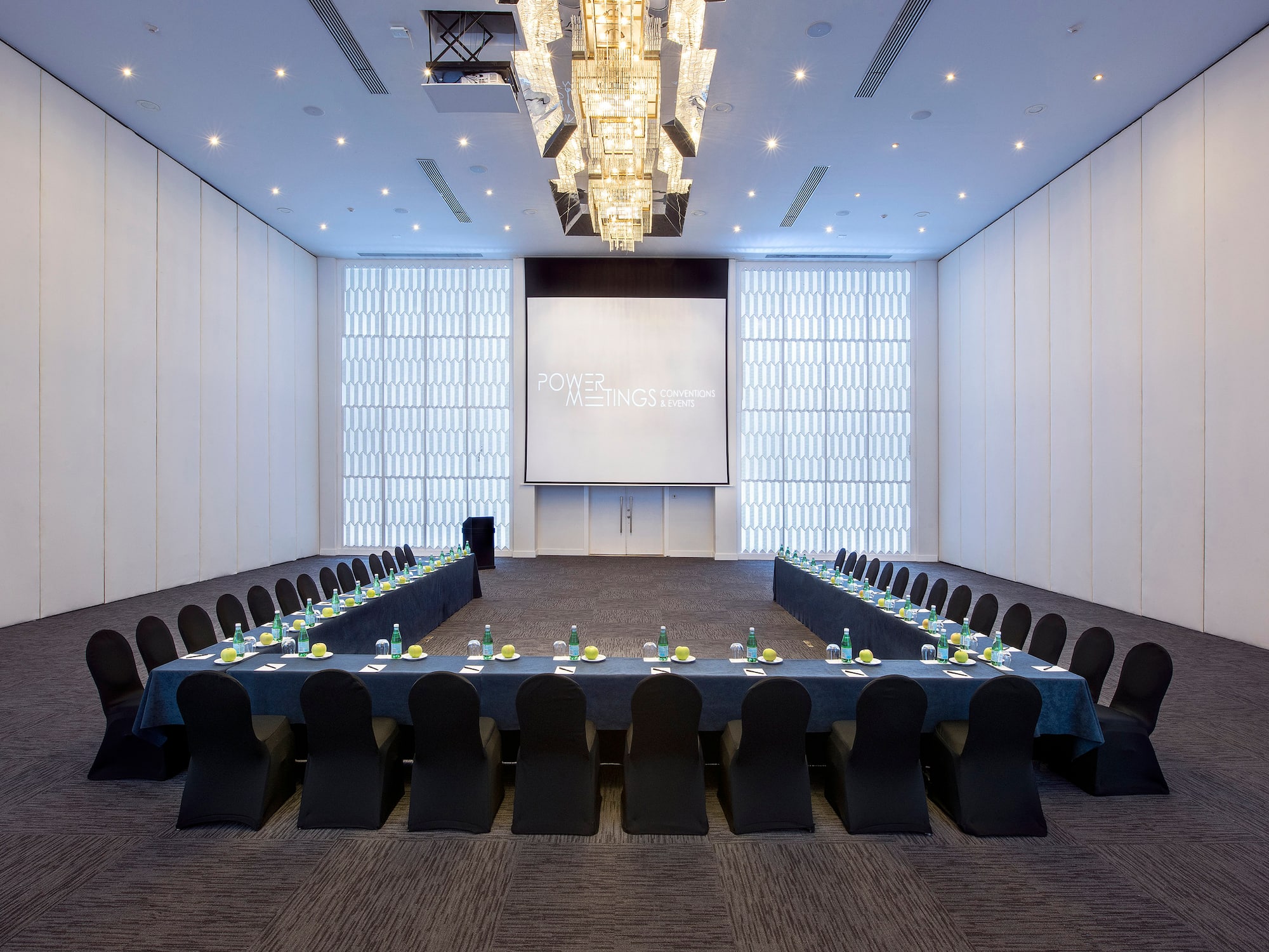 a large conference room with a large screen