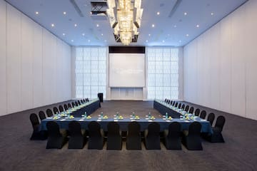 a large conference room with a large screen
