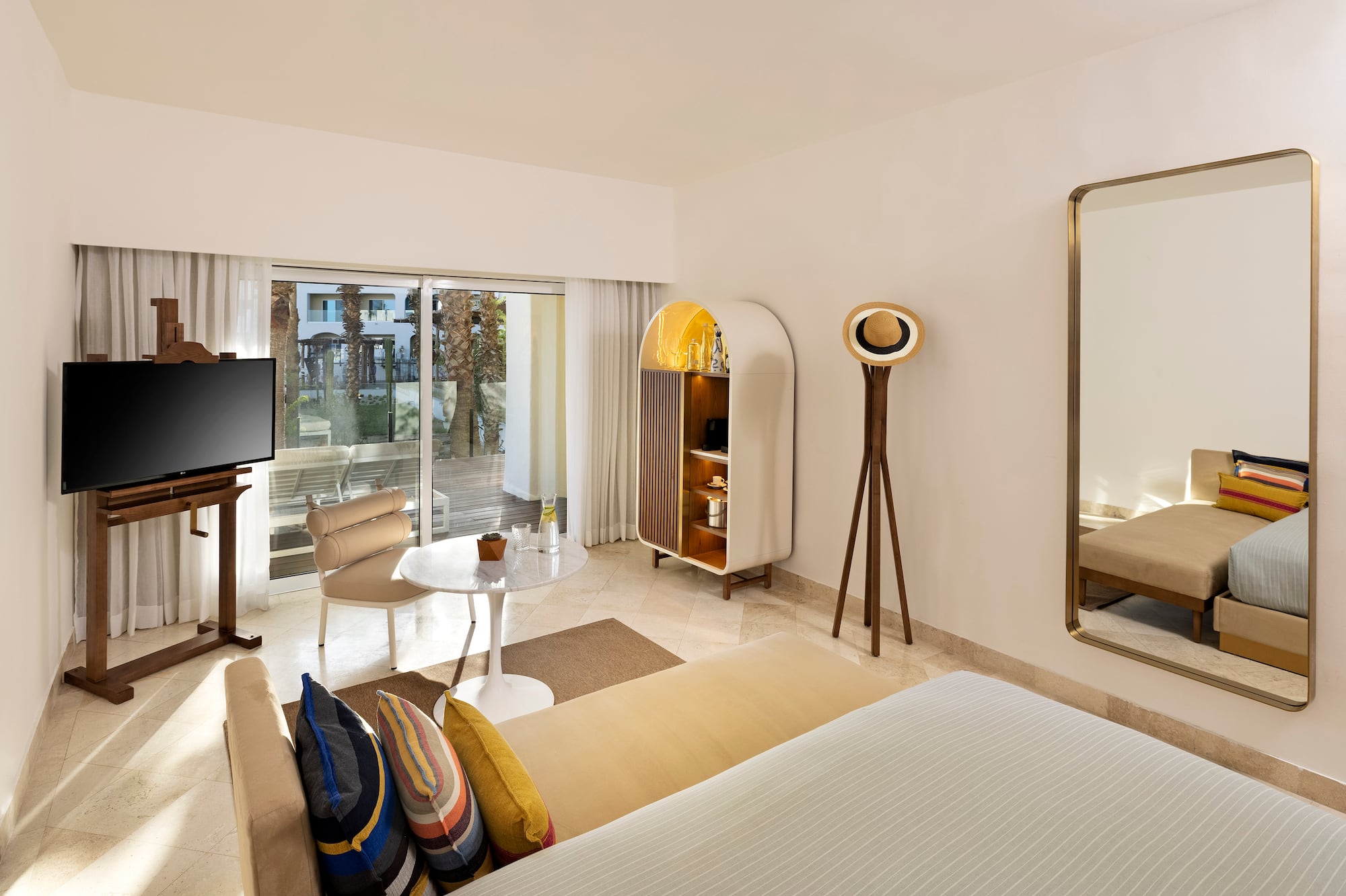 a room with a television and a bed