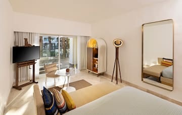 a room with a television and a bed