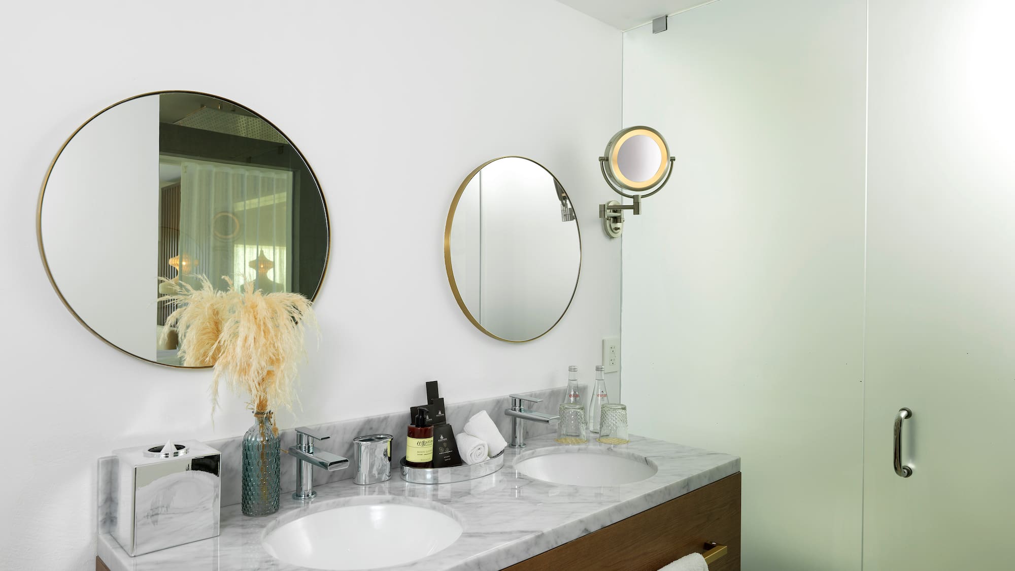 a bathroom with two mirrors