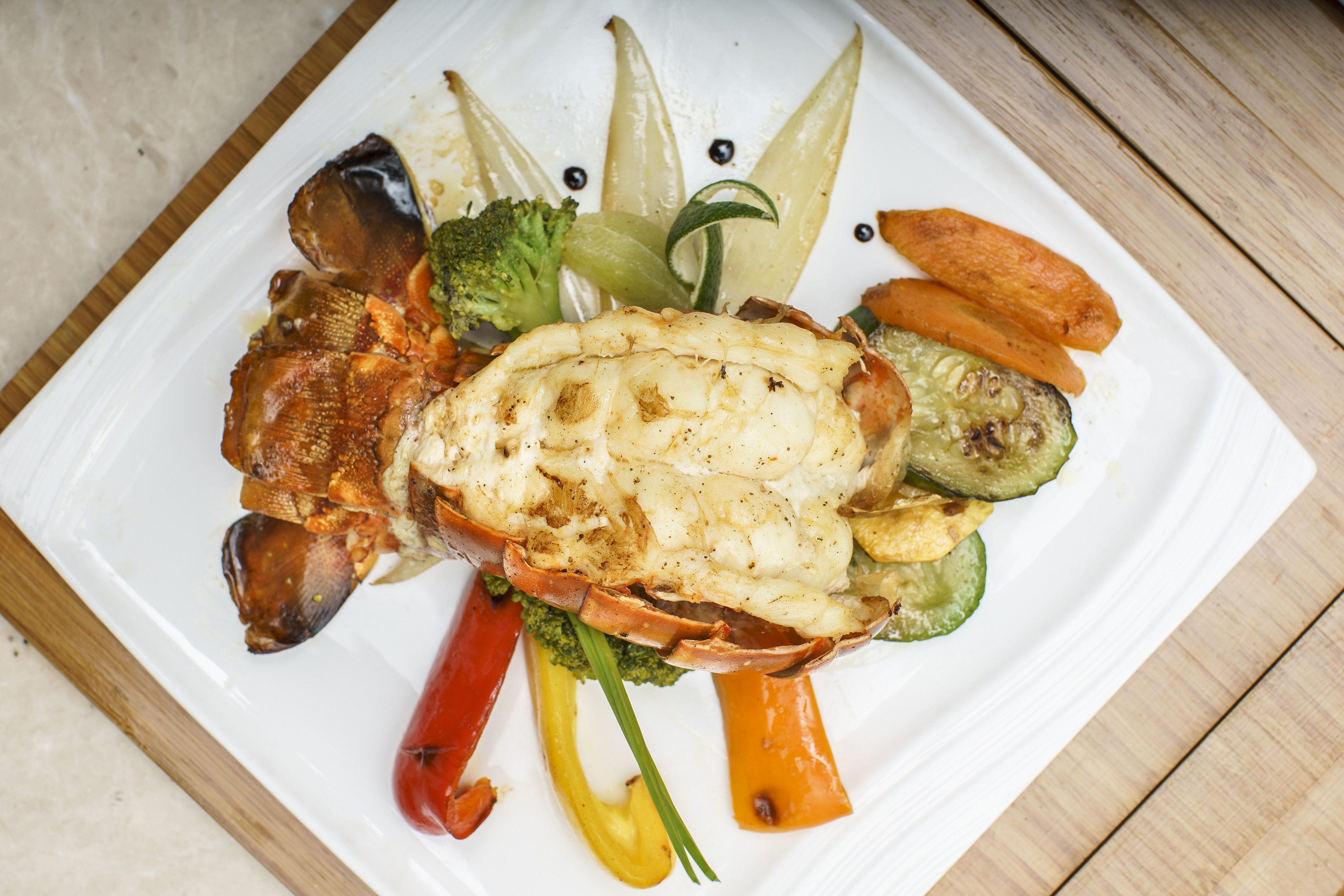 a plate of food on a wood surface