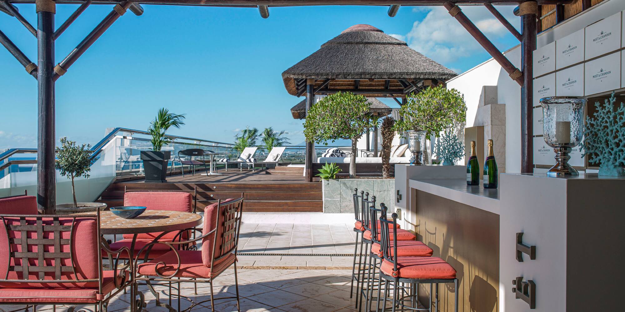 a patio with chairs and tables