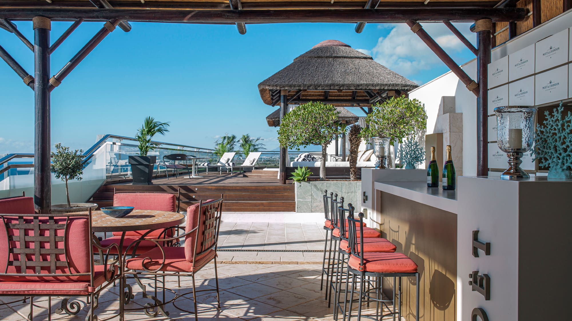 a patio with chairs and tables