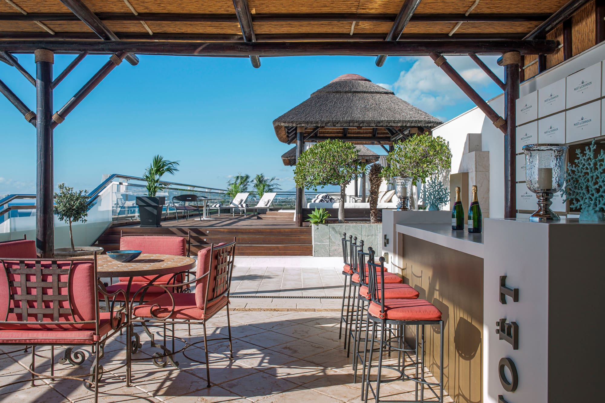 a patio with chairs and tables