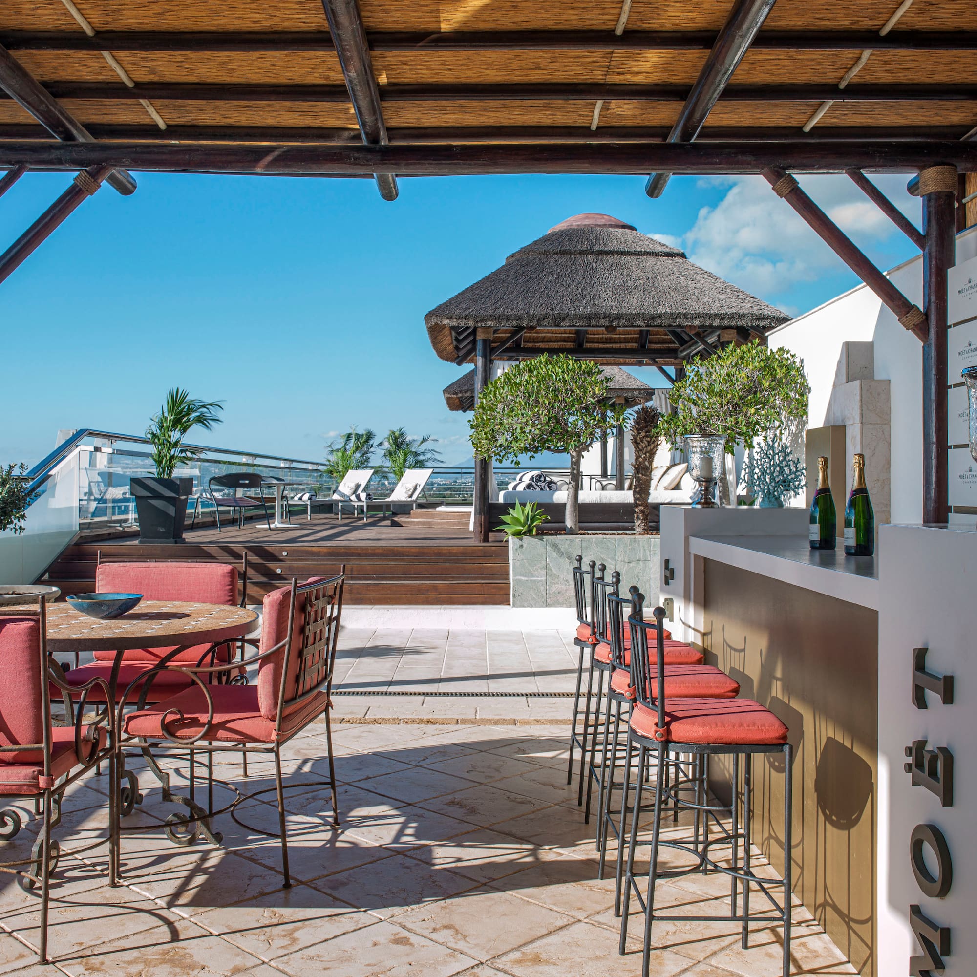 a patio with chairs and tables