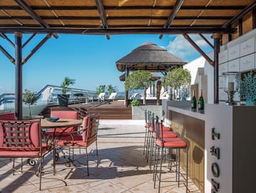 a patio with chairs and tables