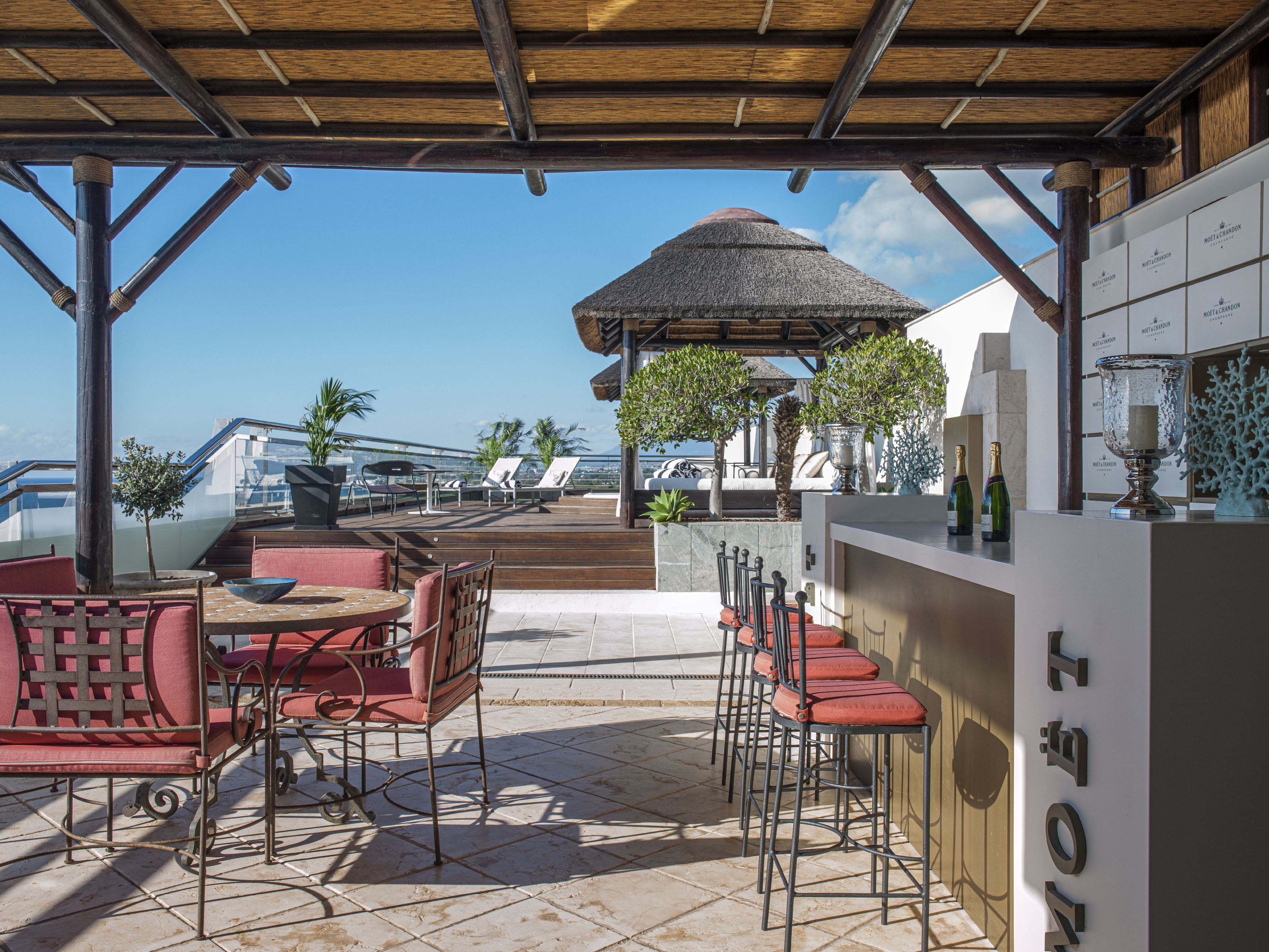 a patio with chairs and tables