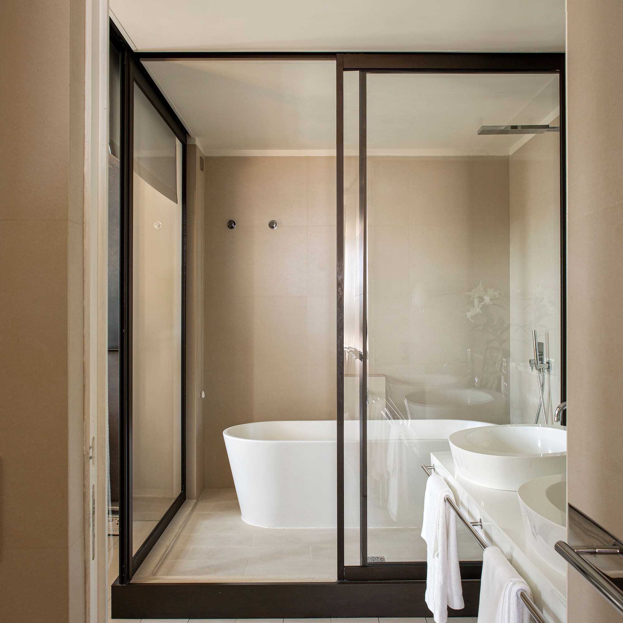 a bathroom with a glass shower door