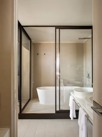 a bathroom with a glass shower door
