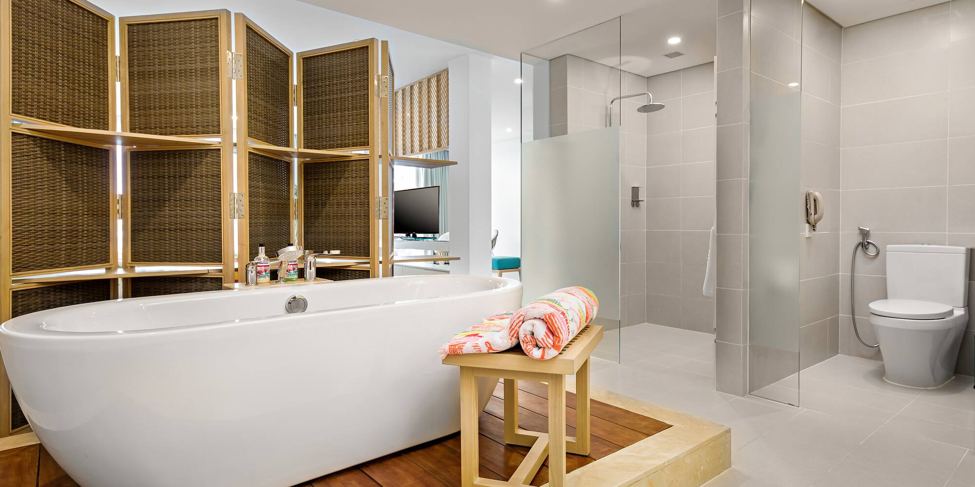 a bathroom with a tub and shower