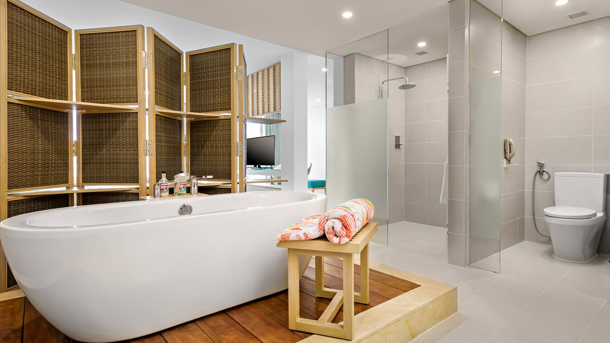 a bathroom with a tub and shower