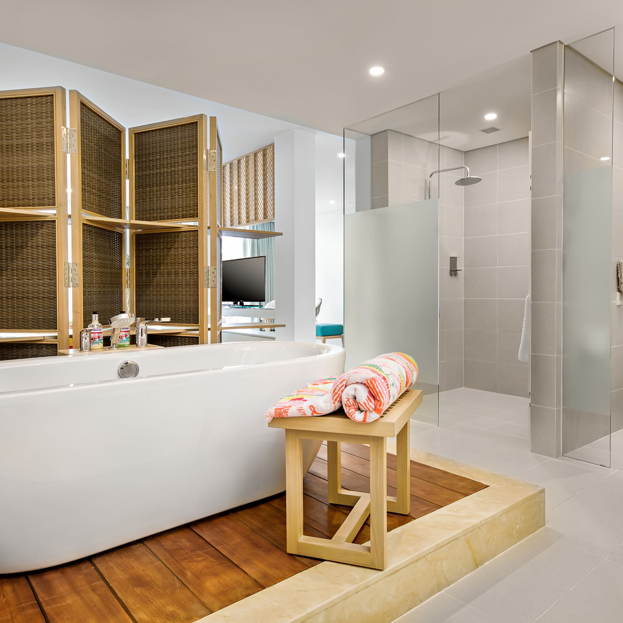 a bathroom with a tub and shower