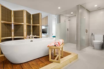 a bathroom with a tub and shower