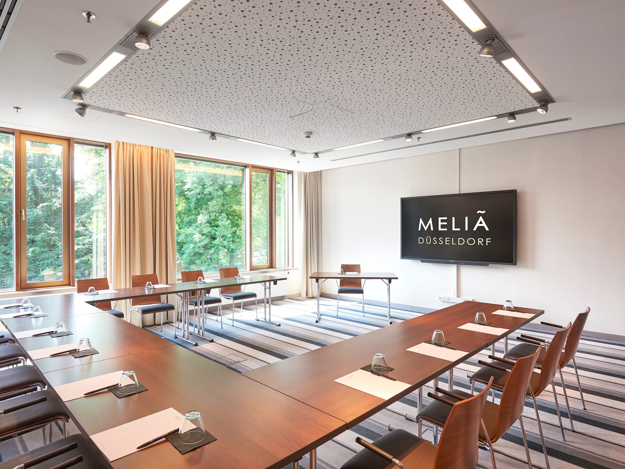 a room with a large table and chairs