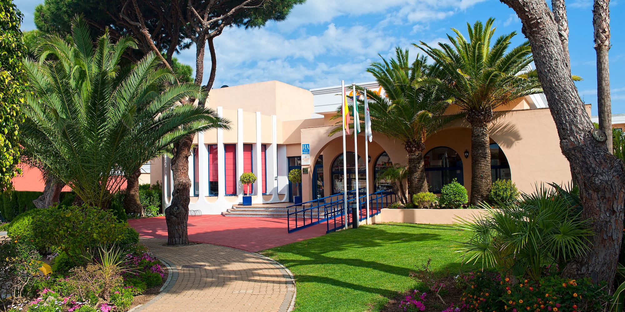 a building with a lawn and trees