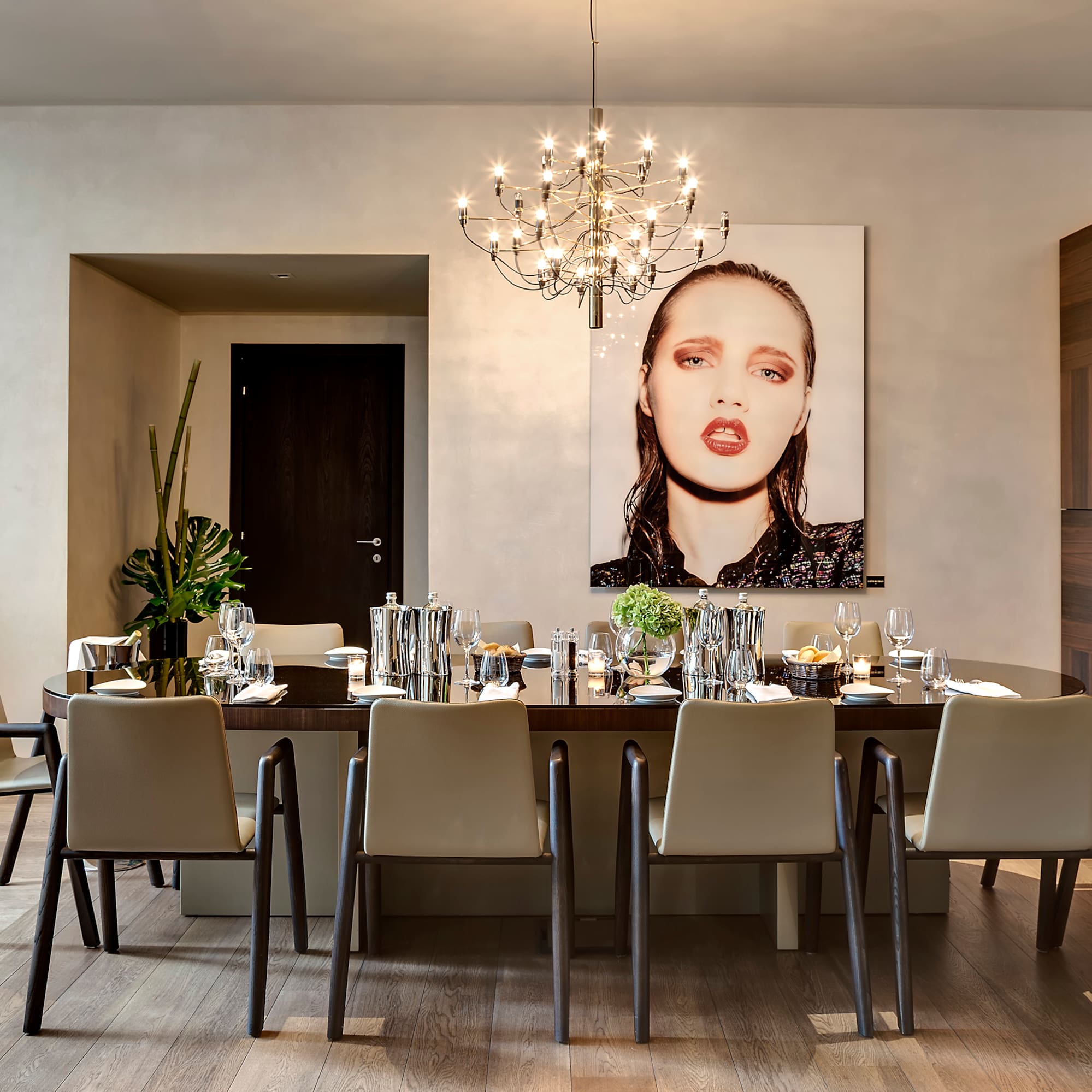 a dining room with a chandelier and a table
