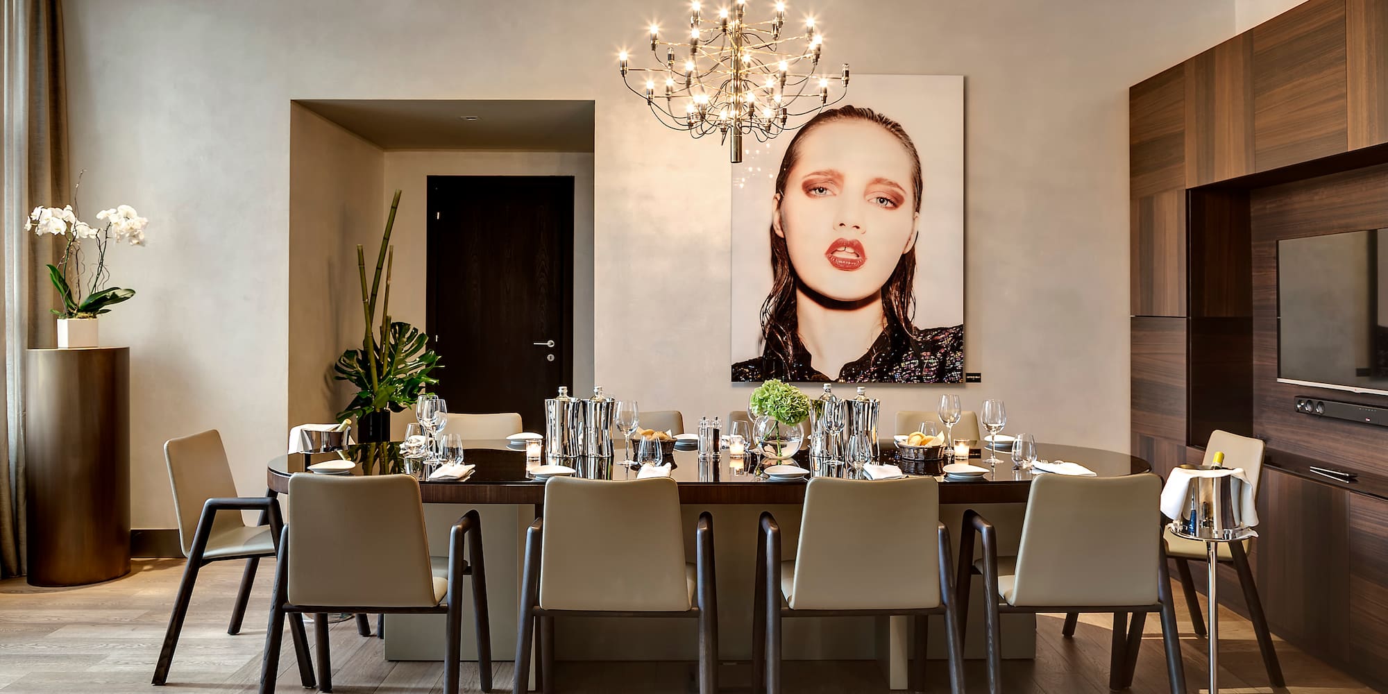 a dining room with a chandelier and a table