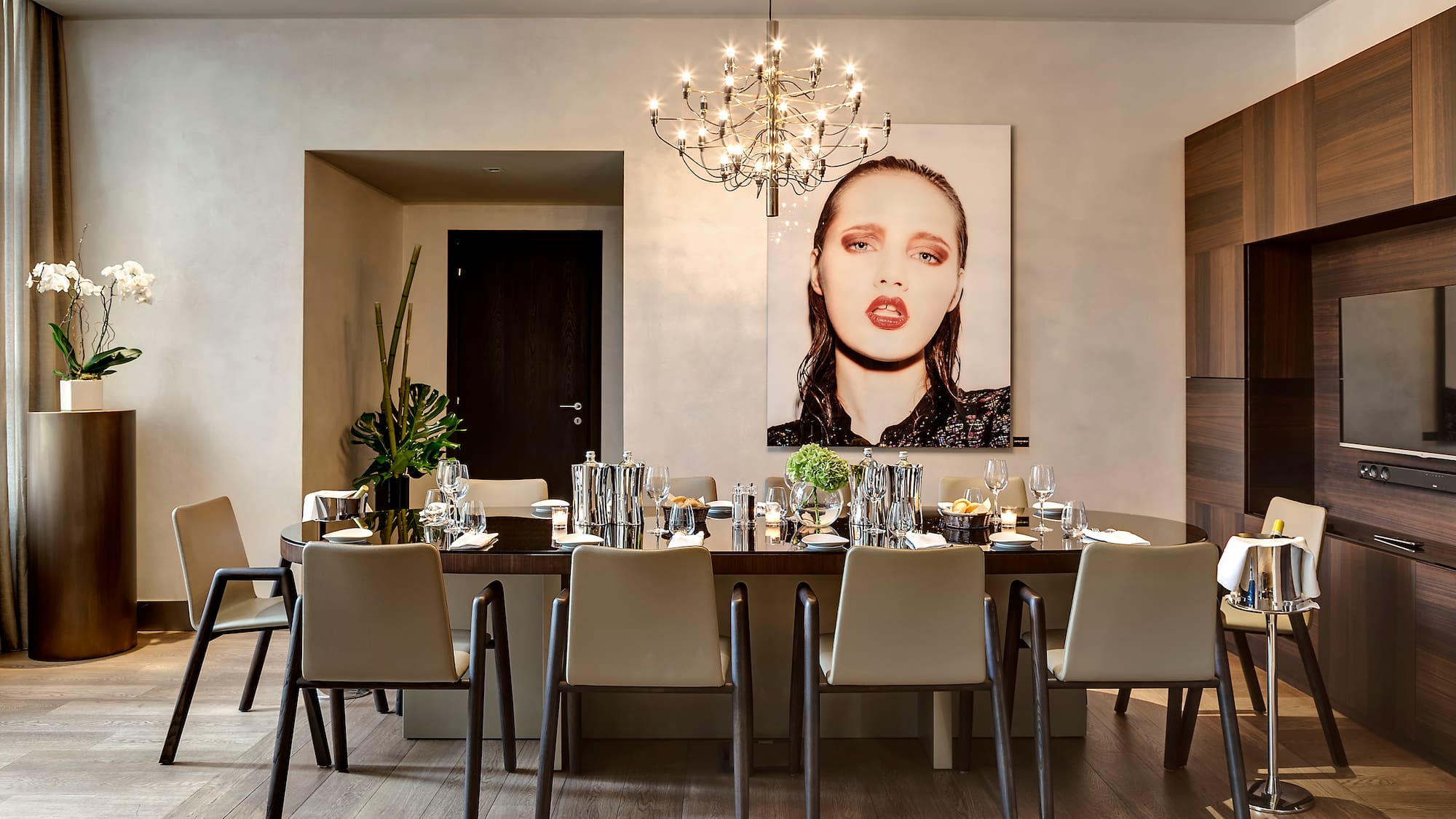 a dining room with a chandelier and a table