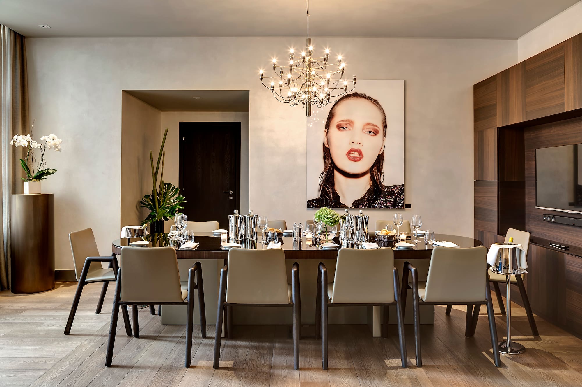 a dining room with a chandelier and a table