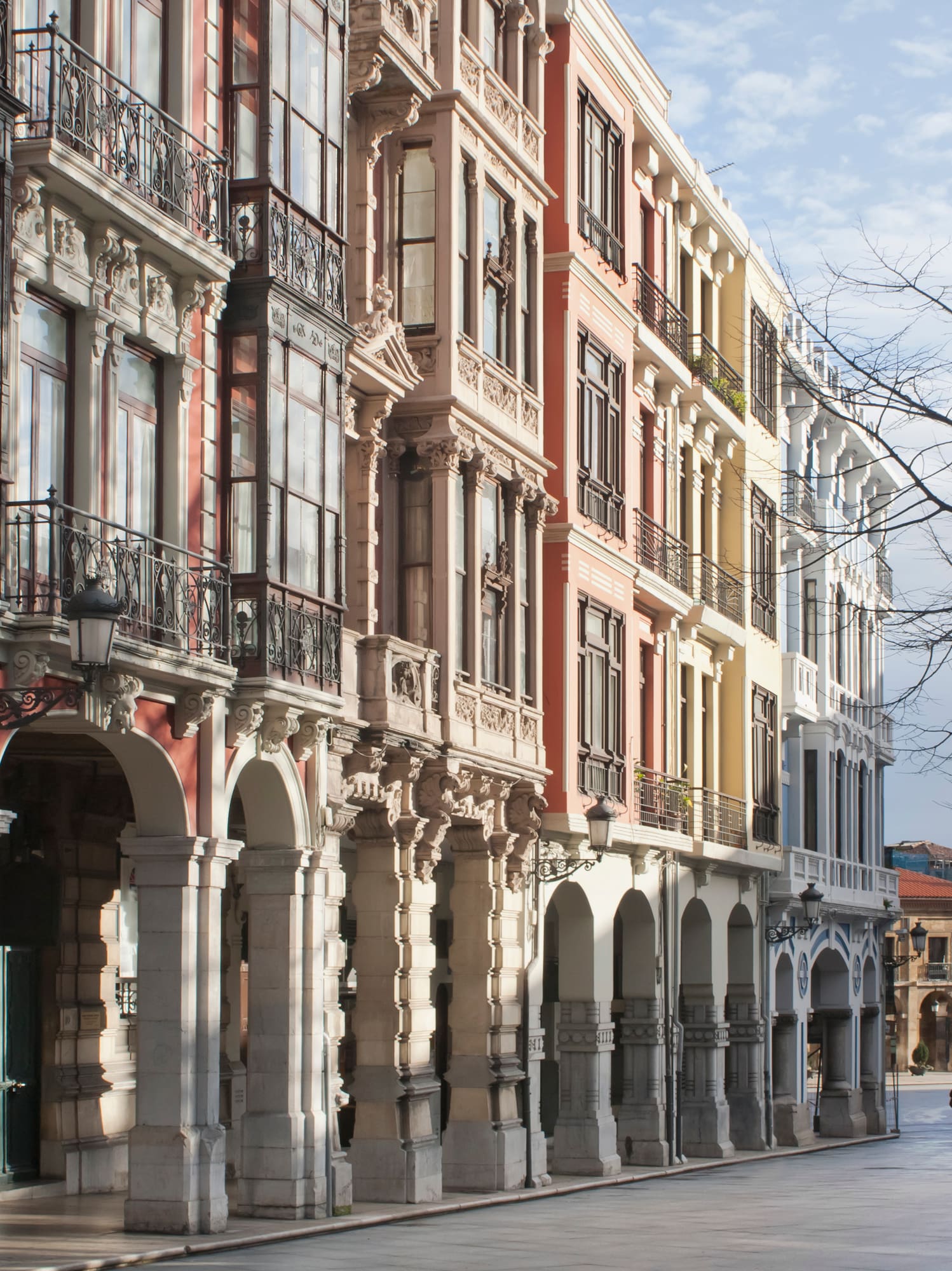 a person walking on a street with buildings