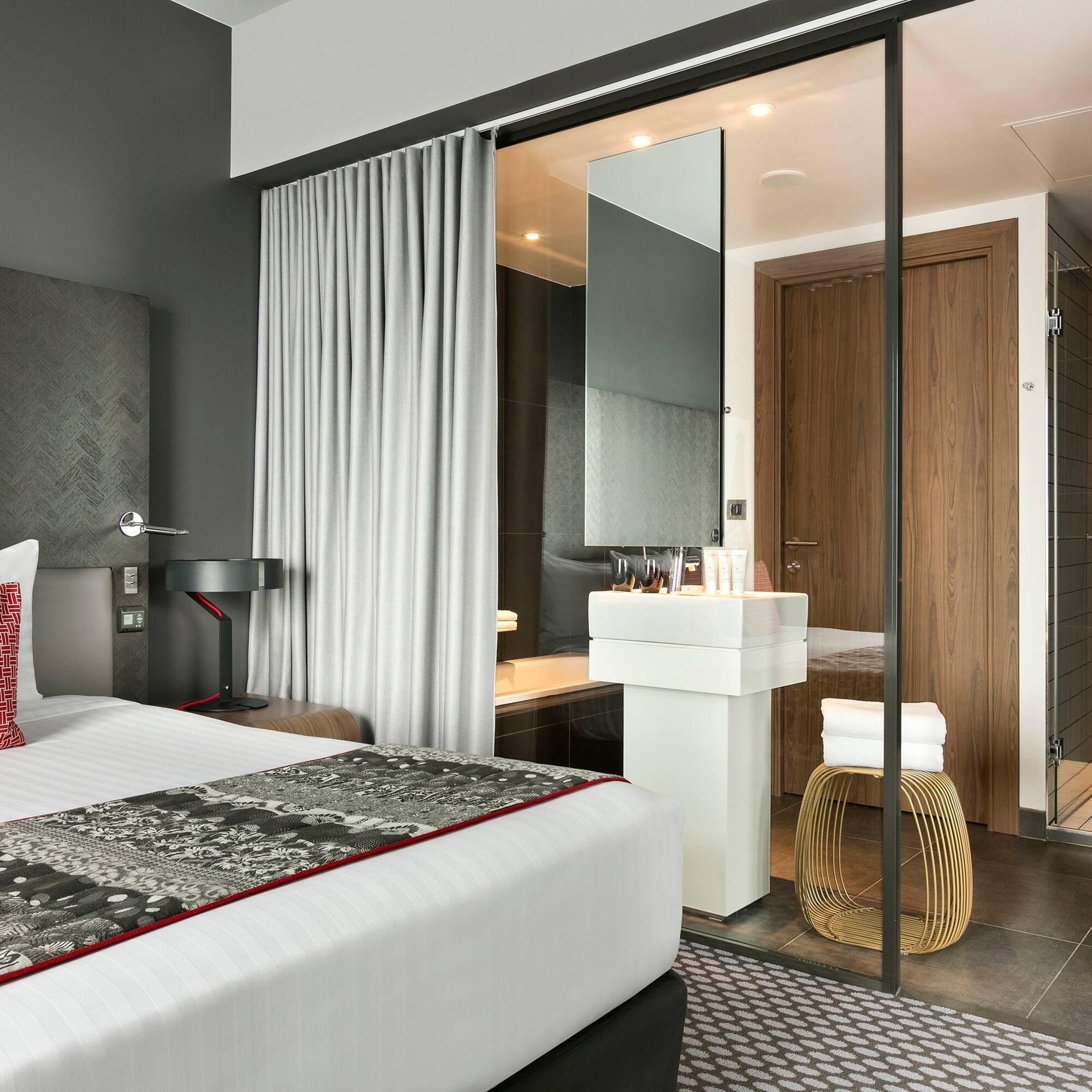 a bedroom with a glass door