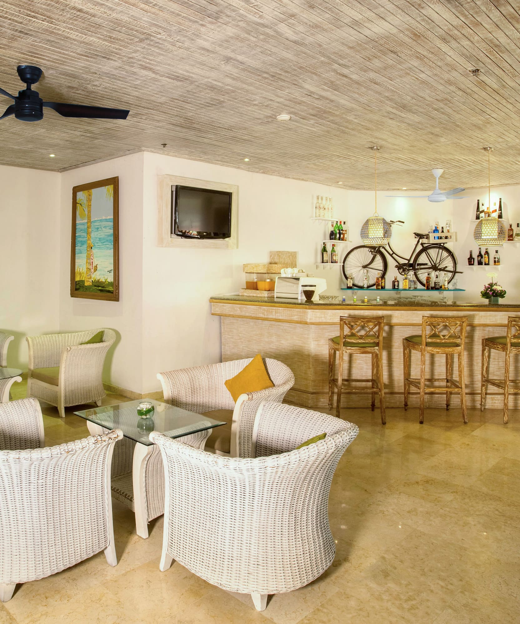 a room with a bar and chairs