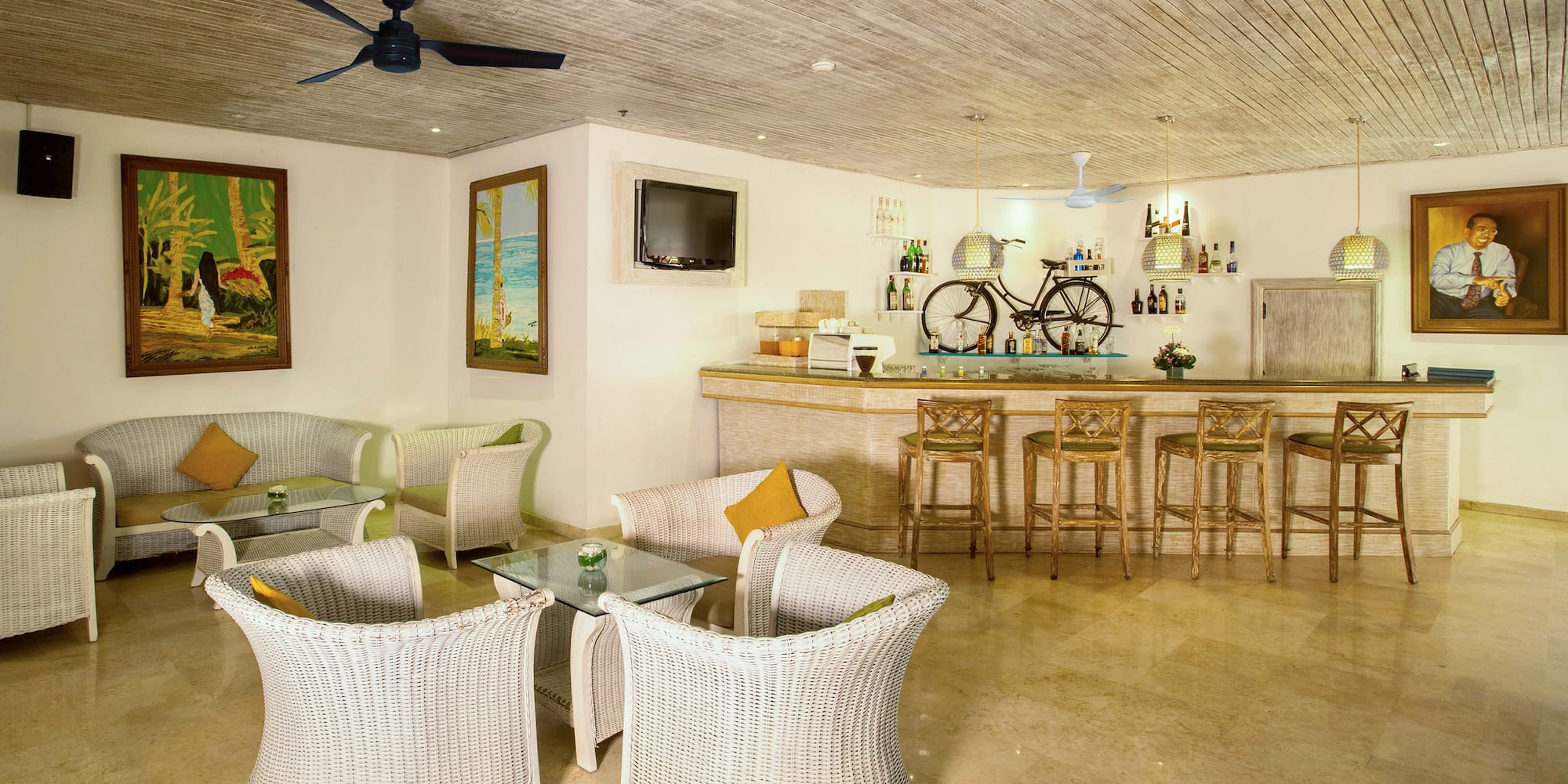 a room with a bar and chairs