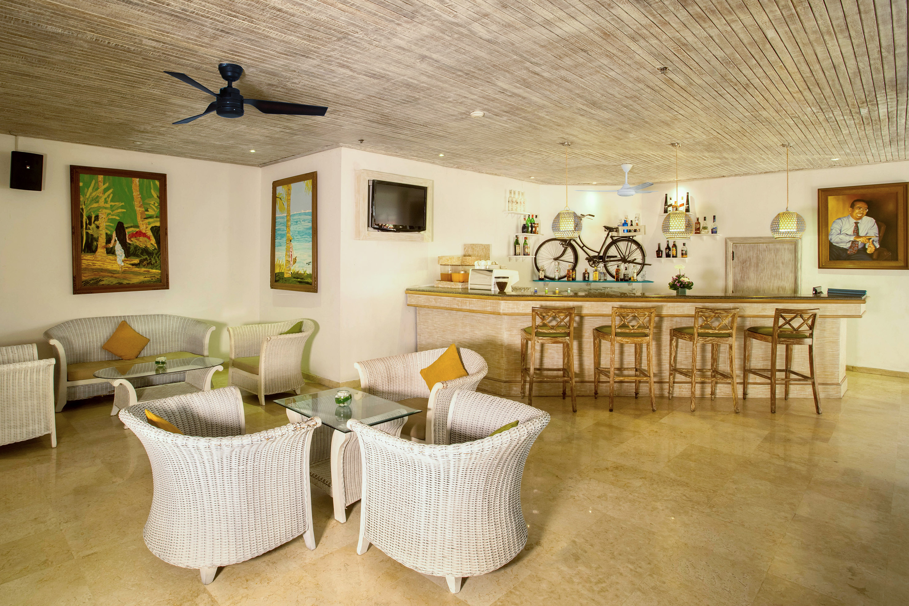 a room with a bar and chairs