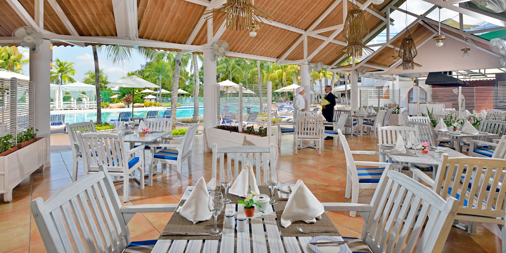a restaurant with tables and chairs