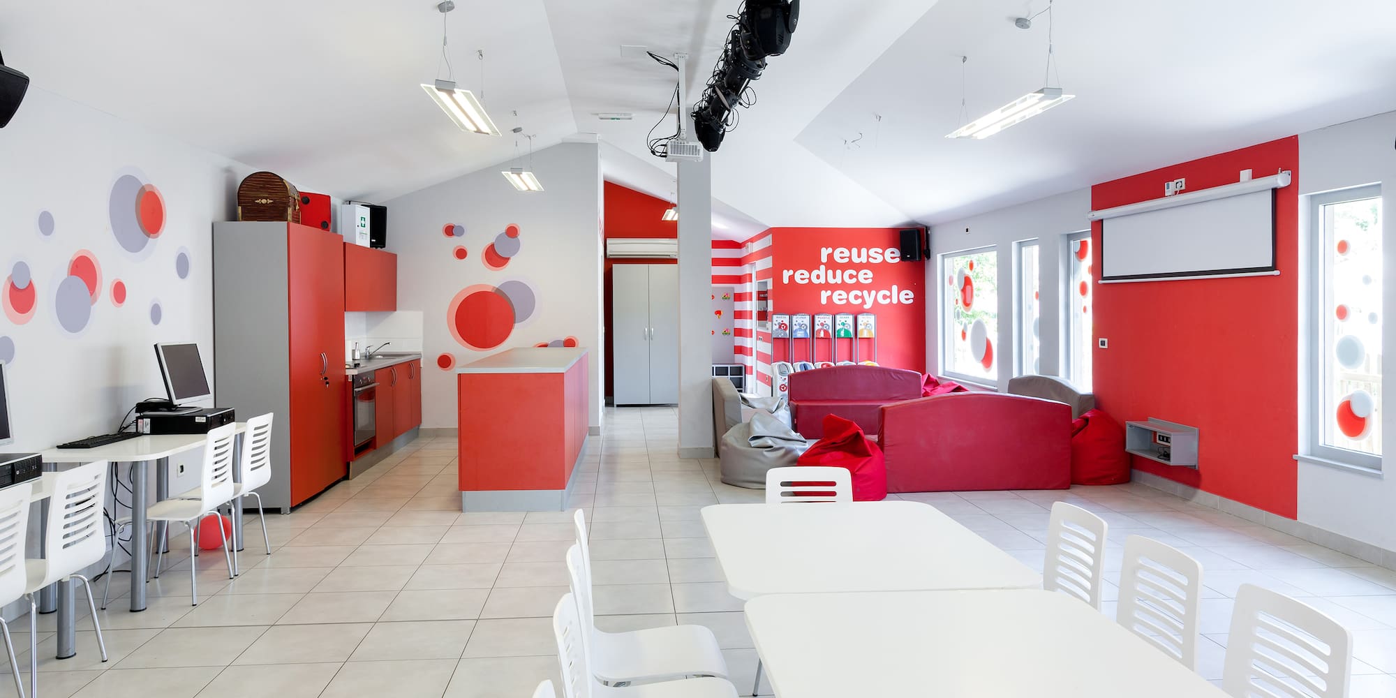 a room with white tables and chairs