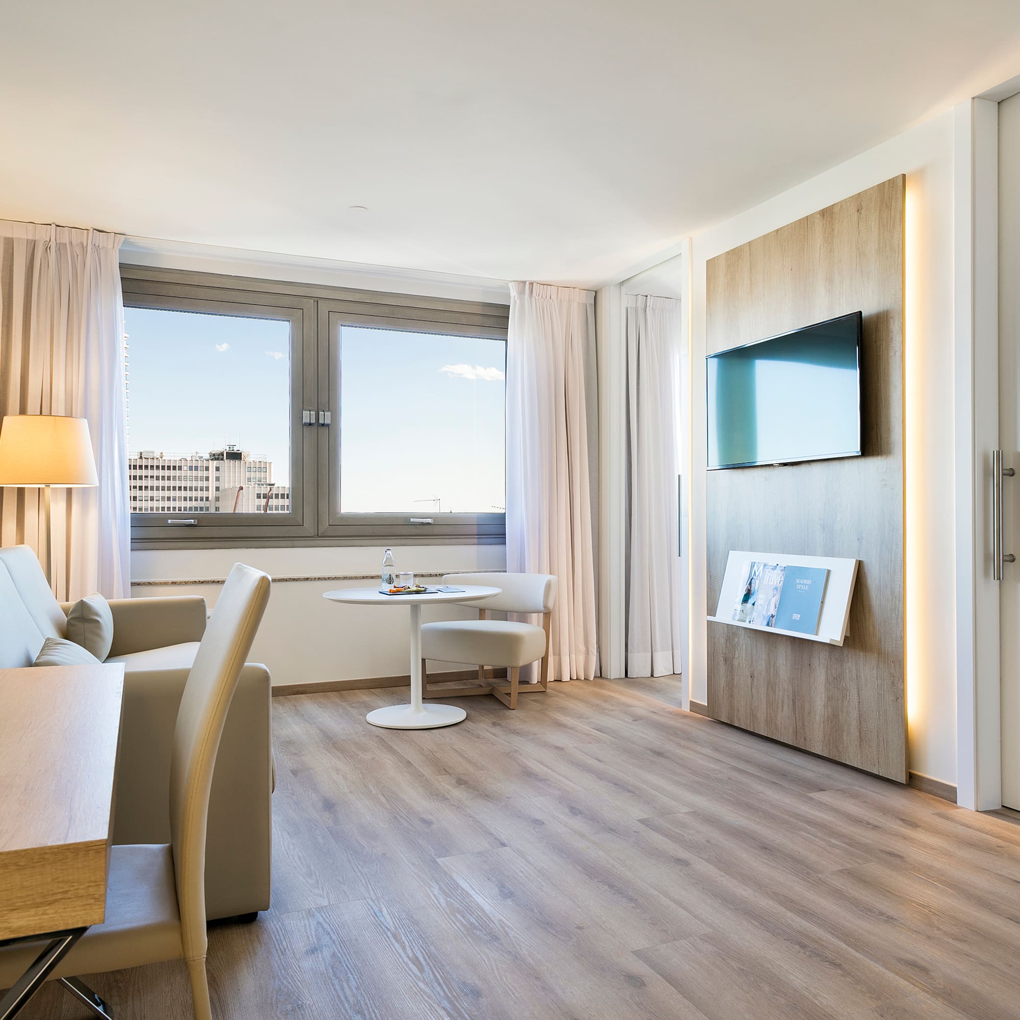 a room with a tv and a table