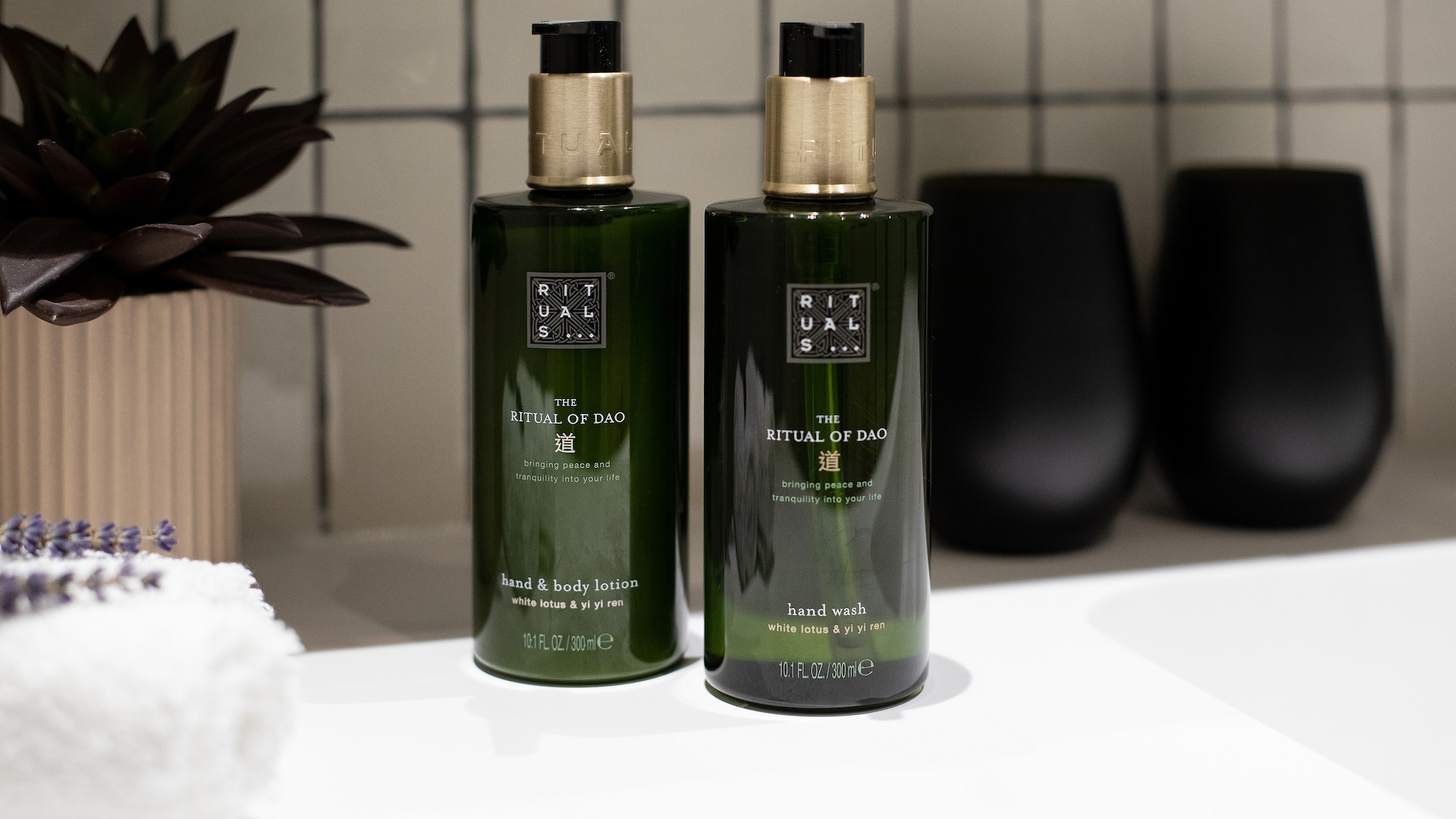 a couple of green bottles on a white counter