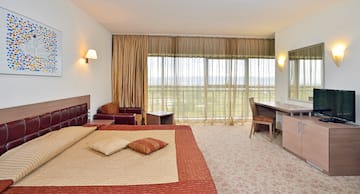 a bedroom with a bed and a desk