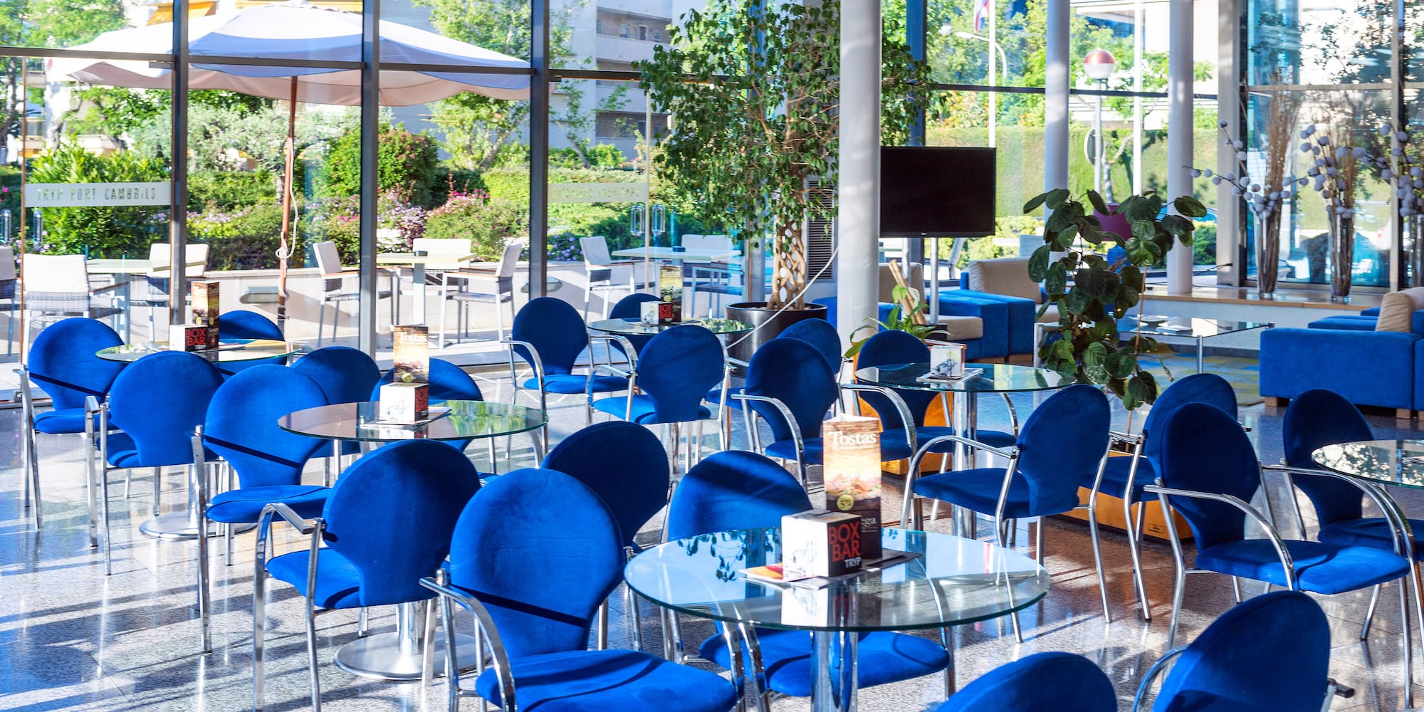a room with blue chairs and tables