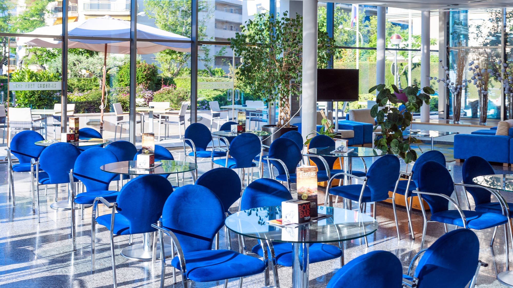 a room with blue chairs and tables