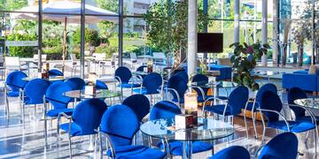 a room with blue chairs and tables