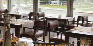 a restaurant with tables and chairs