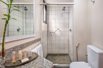 a bathroom with a shower and toilet