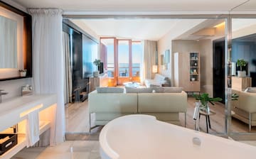 a room with a tub and a tv