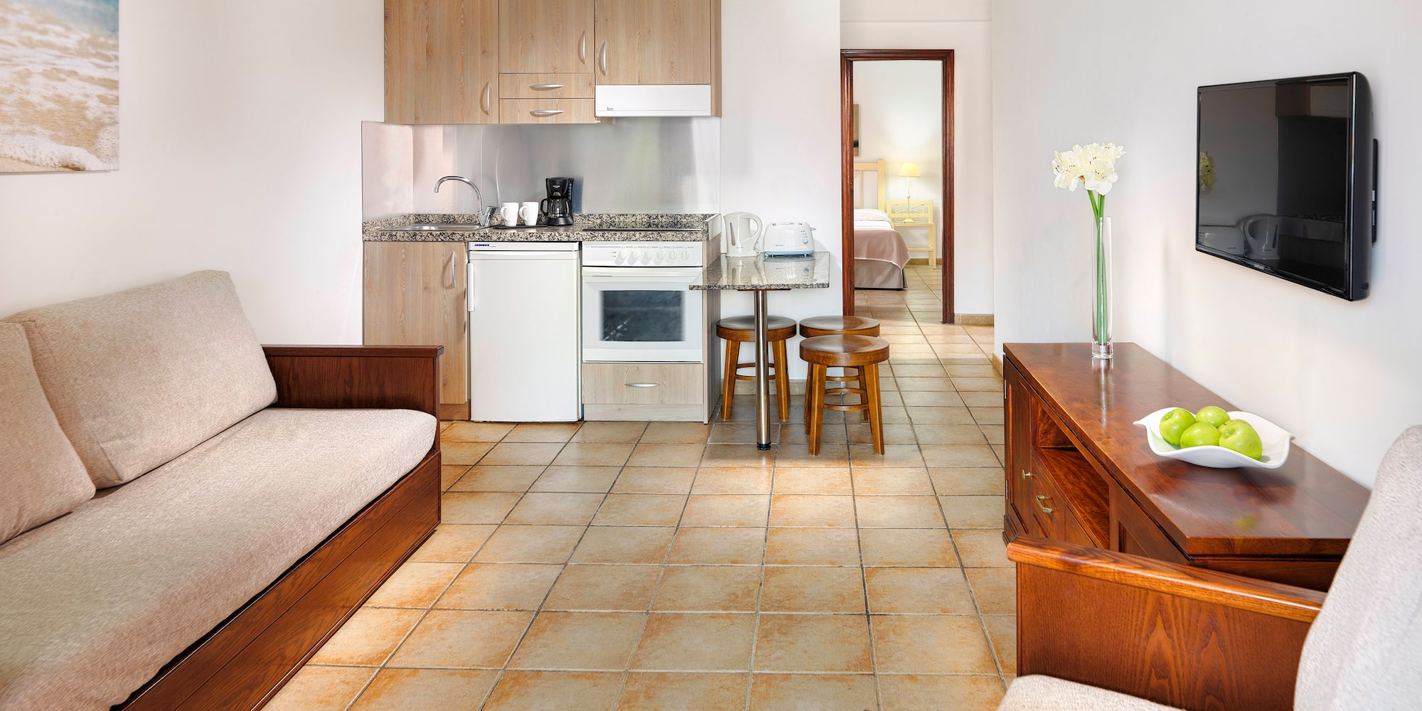 a living room with a tv and a couch