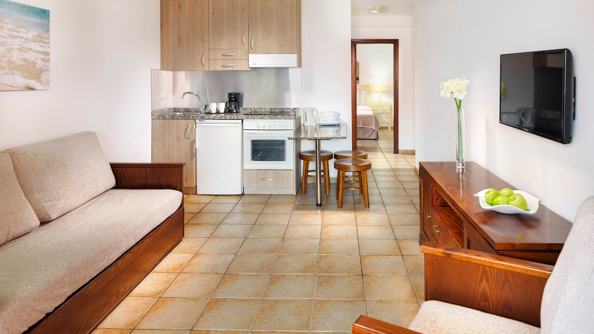 a living room with a tv and a couch