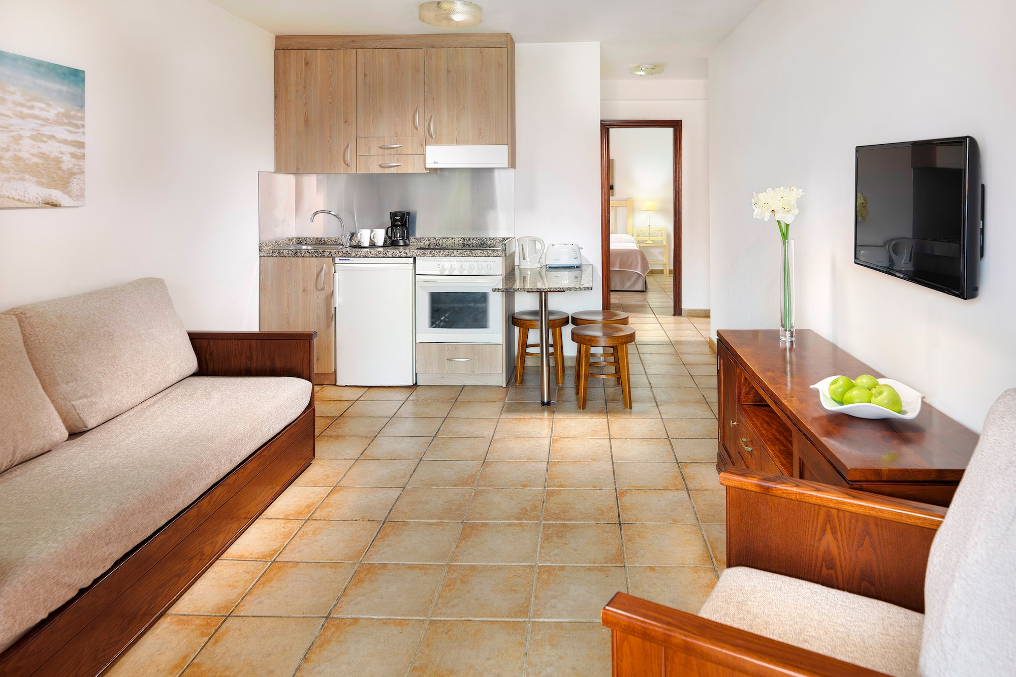 a living room with a tv and a couch