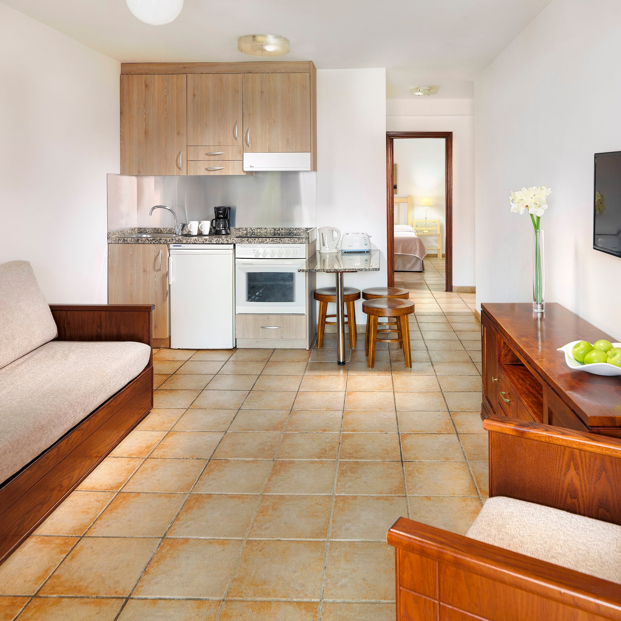 a living room with a tv and a couch