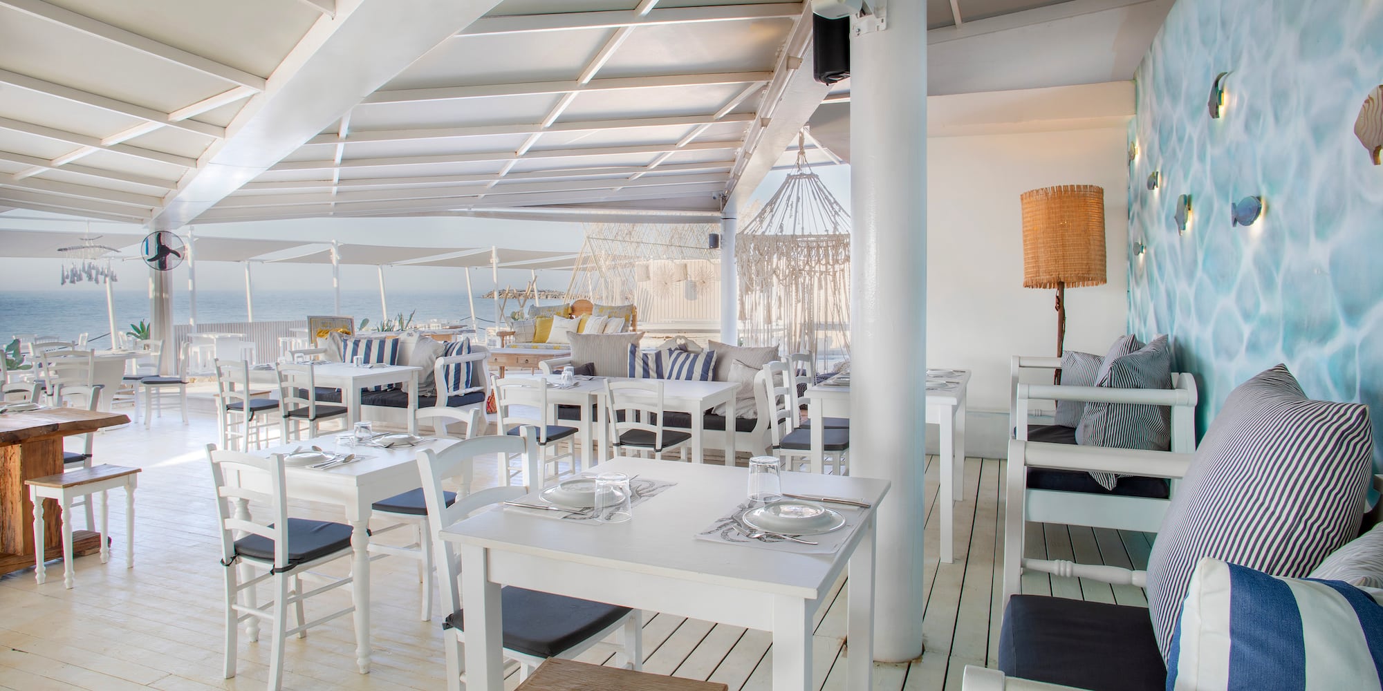 a restaurant with tables and chairs