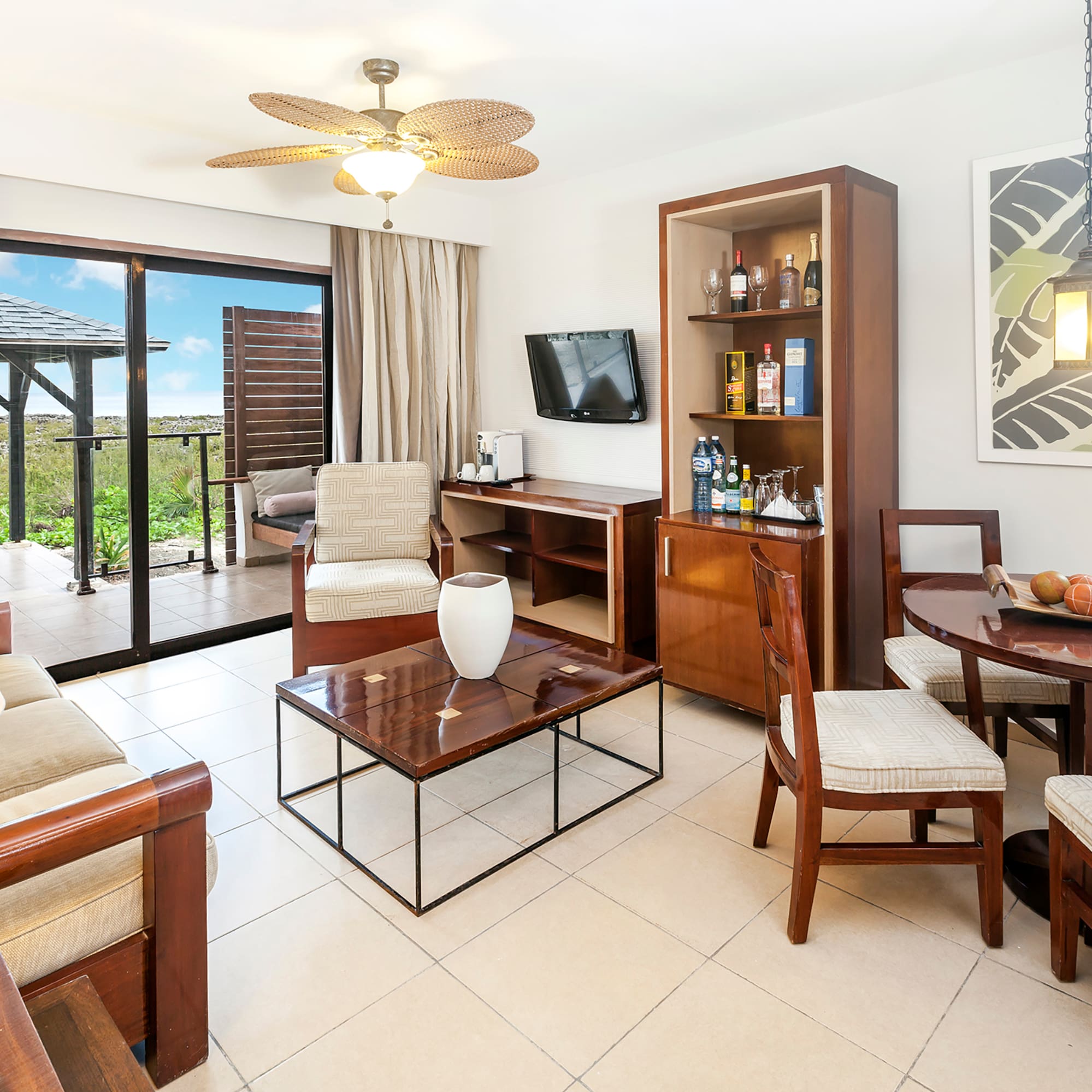 a living room with a television and a table