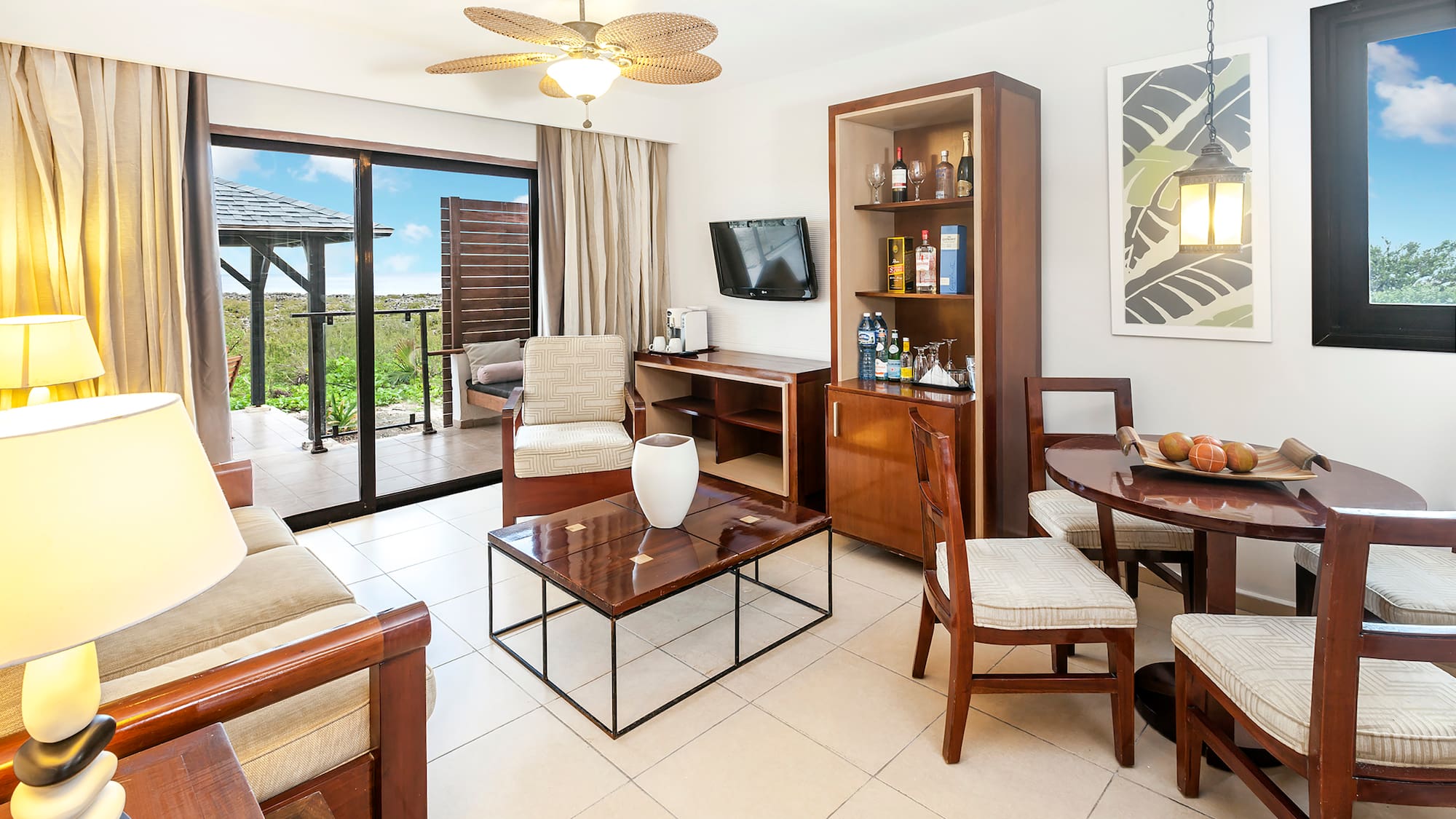 a living room with a television and a table