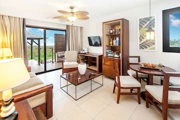 a living room with a television and a table